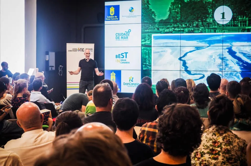 Niall Doherty speaking on stage at Nomad City in Gran Canaria