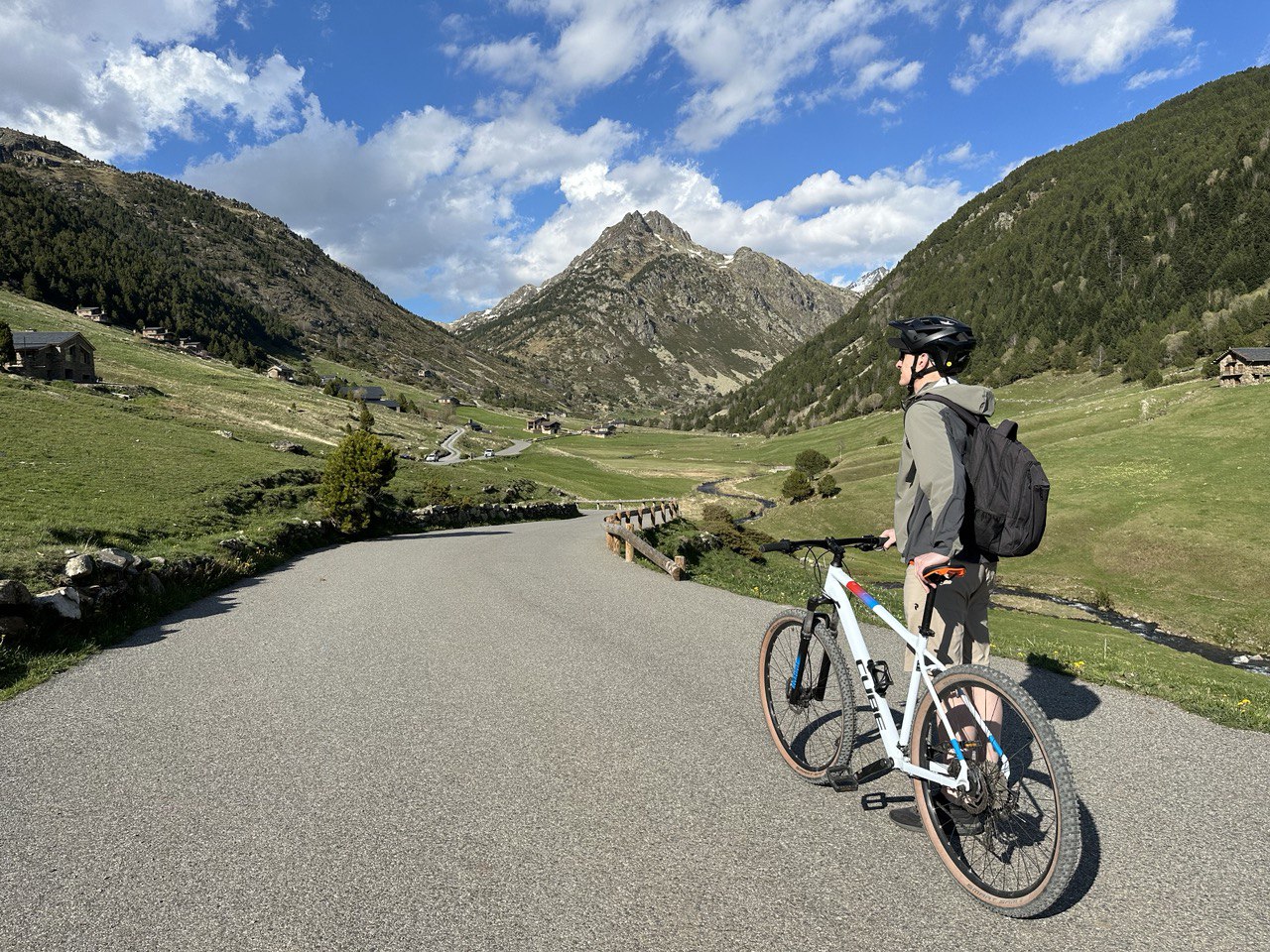 Photo of me standing beside my bike on the road in Vall d'Incles in Andorra.