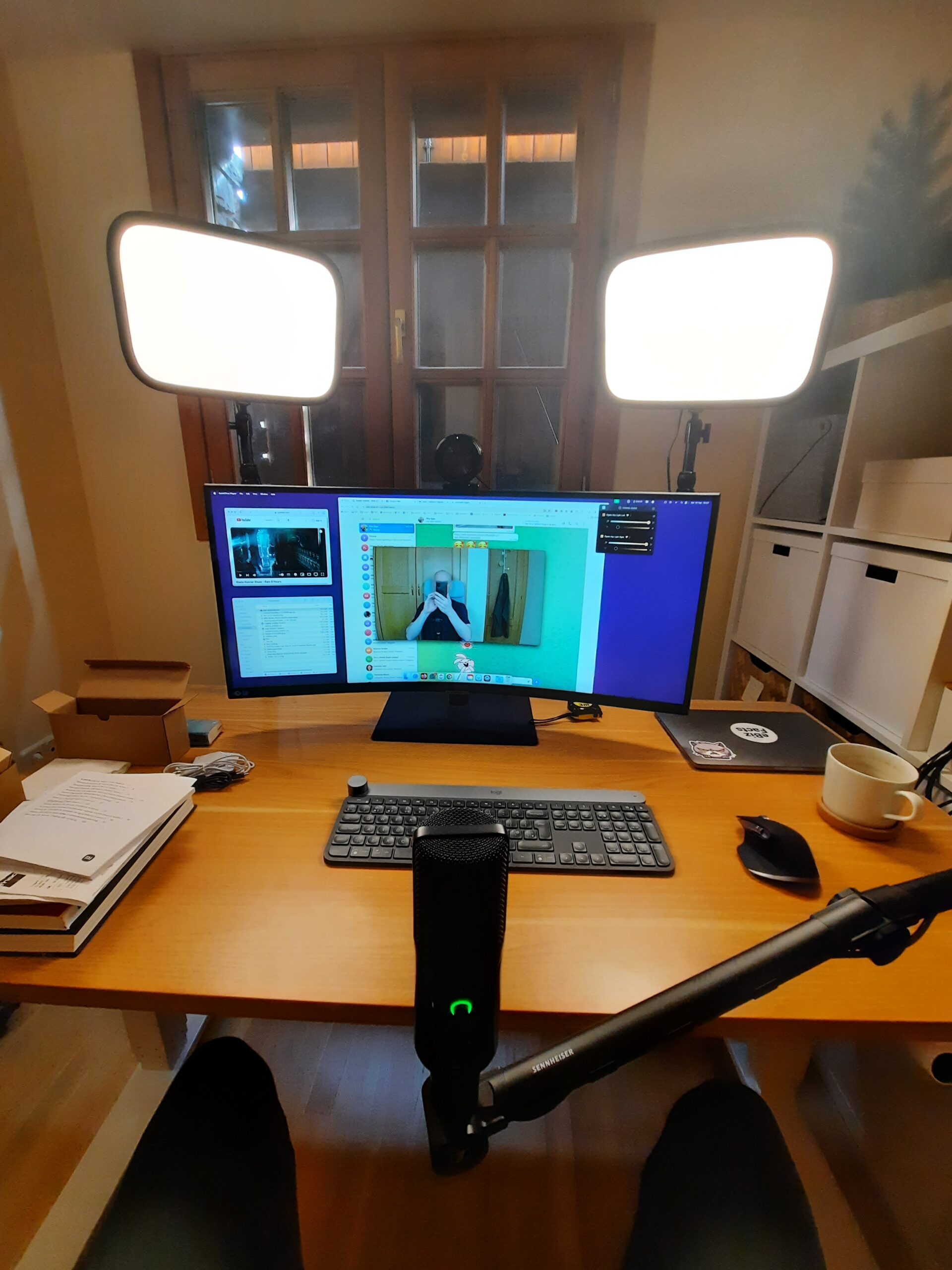 Photo of my home office setup, with curved monitor, keylights and microphone.