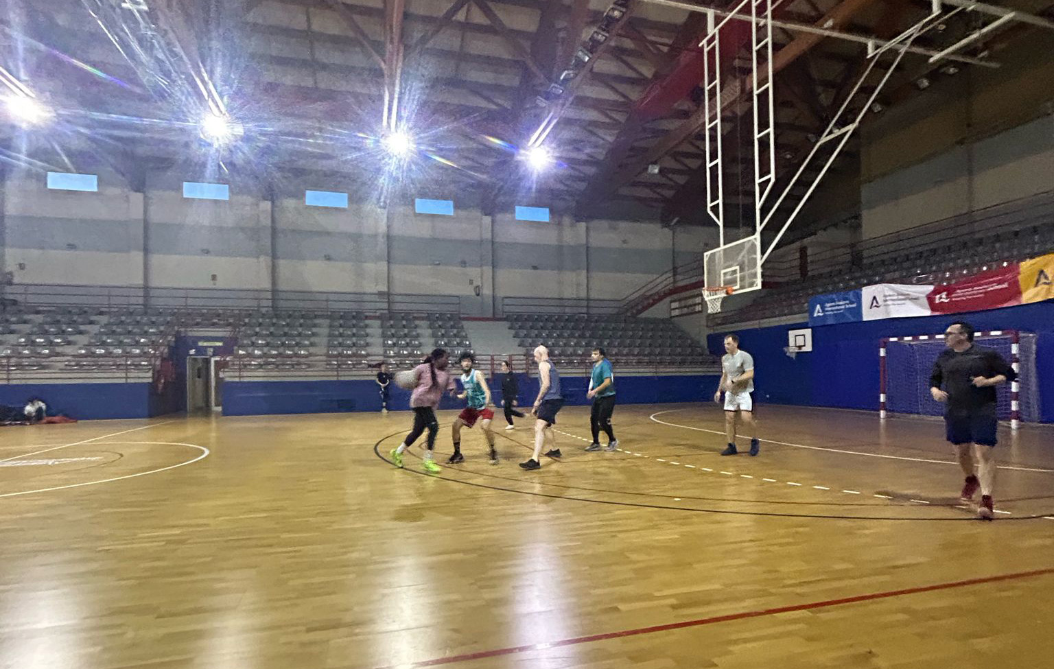 Playing basketball on an indoor court in Andorra.